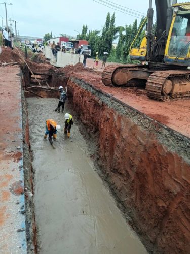 Blinding of excavated trench to received concrete U channel drain